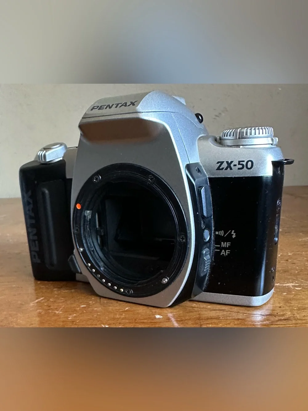 Pentax Silver SLR Camera Body with White Lens Cap